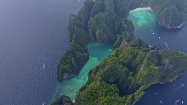 Panoramic aerial of Phi Phi Lee, Maya Bay beach and Phi Leh lagoon. Aerial drone video