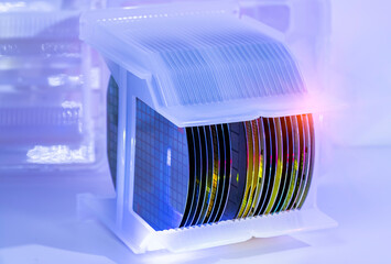 silicon Wafers in white plastic holder box used in electronics for the fabrication of integrated...
