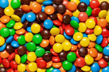 Multicolored dragee, candy background, sweets