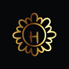Golden letter H monogram in floral badge style in black background luxury emblem design