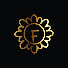 Golden letter F monogram in floral badge style in black background luxury emblem design