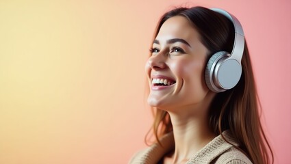 Fototapeta premium Happy Young Woman Listening to Music with Over Ear Headphones Smiling Pastel Background