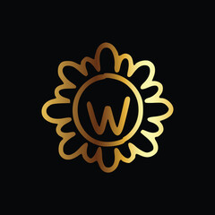 Golden letter W monogram in floral badge style in black background luxury emblem design