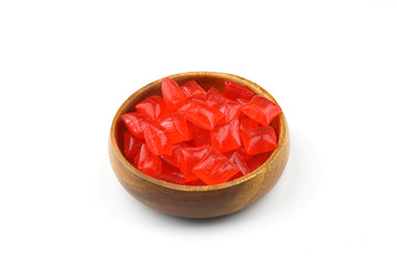 Red sugar in a wooden bowl on a white background. Ramadan Feast candy.