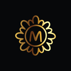 Golden letter M monogram in floral badge style in black background luxury emblem design
