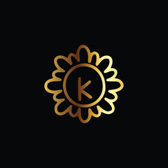 Golden letter K monogram in floral badge style in black background luxury emblem design