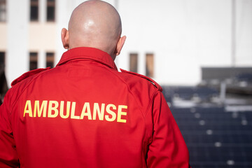 ambulance worker on the roof checking solar panels