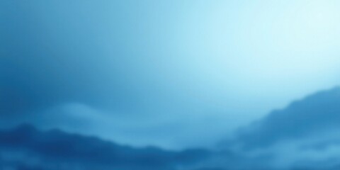 Fototapeta premium Serene Blue Landscape A Soft Focus Background Image of Misty Mountains and a Tranquil Sky
