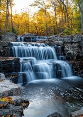 Serene Waterfall Cascading Over Rocky Terrain Surrounded by Autumn Foliage and Vibrant Colors in a Peaceful Nature Setting During Golden Hour
