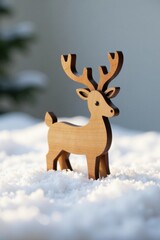 A charming wooden reindeer figurine stands gracefully amidst a soft blanket of pristine snow, capturing the essence of winter's gentle beauty and the festive spirit of the season.