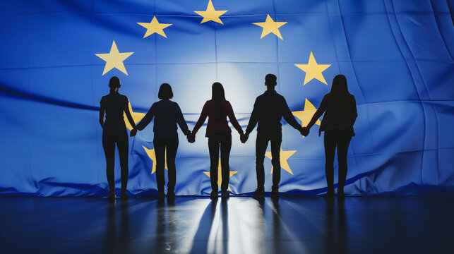 Silhouettes of five people holding hands under a European Union flag.