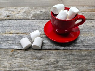 red cup filled with white marshmallows.