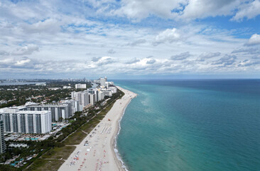 Obraz premium Coastline of Miami. Miami south beach aerial view. Sea beach seashore and coastline. Summer vacation in Miami, Florida. Sea vacation on beach. Aerial marina view. Turquoise waters
