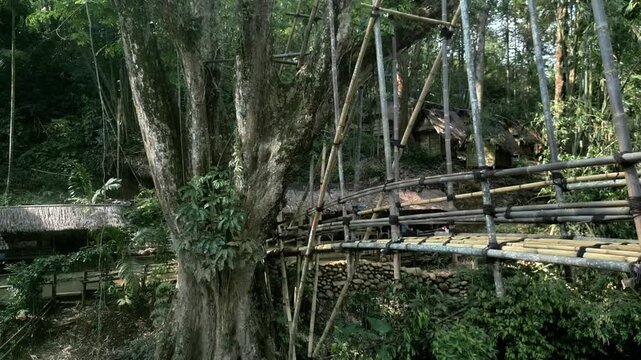 Drone movements show details of the bamboo bridge as a link between Baduy Tribe villages, which is evidence of a community that always maintains a life in harmony with its natural surroundings.