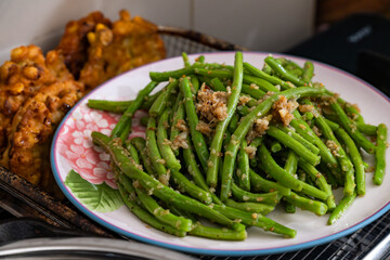 plate of stir fried green beans with garlic