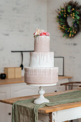 fake pink cake on wooden table. plastic cake for children photo shoots