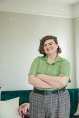 Non Binary Person in Business Casual Attire Smiling at the Camera