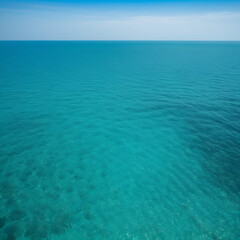 Fototapeta premium Small ripples on sea surface, blue-green water near tropical island of Thailand. Static view of empty open space, light haze from midday heat seen at horizon line