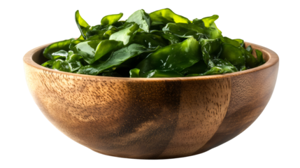 Wooden bowl containing glistening green wakame seaweed, highlighting fresh marine ingredient against transparent backdrop