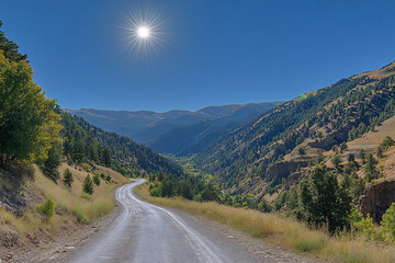 Fototapeta premium a photograph of an asphalt road winding through the mountains,