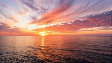 Obraz premium Vibrant Sunset over Calm Ocean