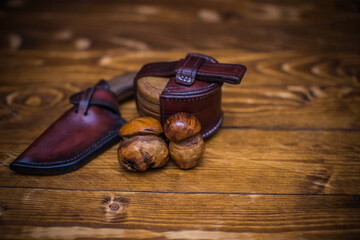 Rustic Composition Featuring Leather Accessories and Wooden Background