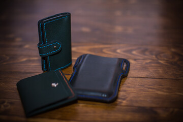 Luxurious Leather Wallets and Accessories on Wooden Surface With Artistic Lighting