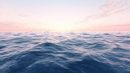 Fototapeta premium A soft pink sunset over a calm ocean.