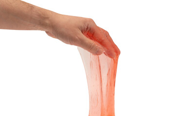 Red slime toy in man hand isolated on white.