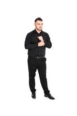 A handsome dark-haired man wearing a business suit, a black shirt on a white background