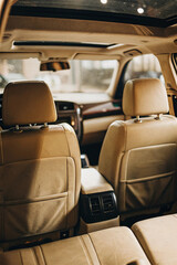 A pristine car interior, showcasing sleek design, clean surfaces, and modern technology, reflecting luxury and attention to detail