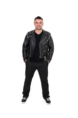 Fototapeta premium A handsome dark-haired man in a black leather jacket, black T-shirt, trousers and sneakers on a white background
