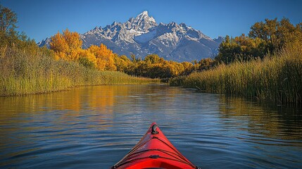 Kayaking through autumnal Teton river