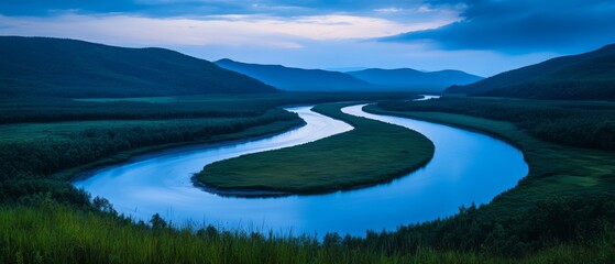 A winding river carves through the landscape, reflecting the twilight sky's hues, inviting awe with its gentle curves and endless horizon.