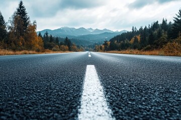 black asphalt road and white dividing lines