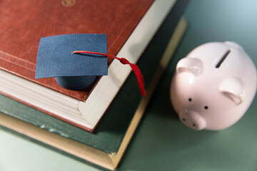 piggy bank with stack of books