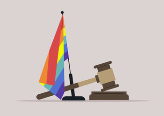  vibrant rainbow flag stands alongside a judge's gavel, signifying the pursuit of justice and equality for the LGBTQ community, This powerful imagery conveys a message of acceptance and advocacy © nadia_snopek