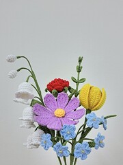 crochet colorful flower bouquet on white background