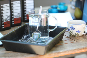 Objects for analog film development, including reels, tanks, chemicals, and darkroom tools. Concept of traditional photography, darkroom process, and film photography workflow.