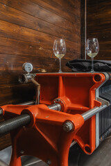  a traditional wine press, likely used for crushing and extracting juice from grapes during the...