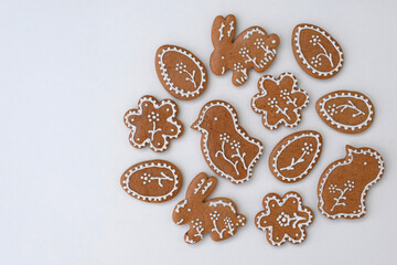 Romantic decorated Easter gingerbread cookies of various shapes, white background, copy space for...