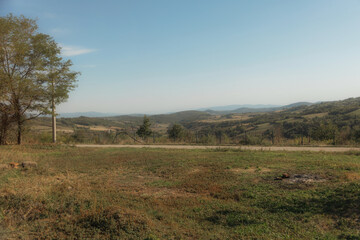 The image depicts a charming and well-maintained residential property, likely located in a rural or...