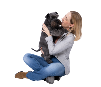 Young happy woman hugging her little schnauzer dog sitting on floor isolated over transparent background. PNG transparent