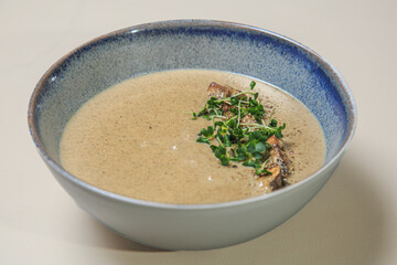 a bowl of creamy mushroom soup. 
