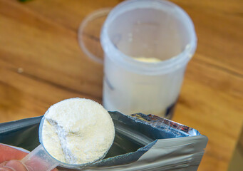 protein and carbohydrate cocktail preparation using a shaker. Dietary activity. healthy lifestyle, healthcare nutrition concept. protein powder.