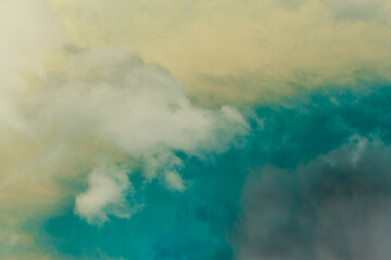 Teal Sky and Clouds. A colorful sky with clouds. Cloud in the background. Phone or desktop wallpaper.