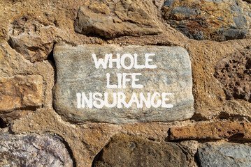 Whole life insurance symbol. Concept words Whole life insurance on beautiful grey stone on stone wall. Beautiful stone wall background. Business whole life insurance concept. Copy space.