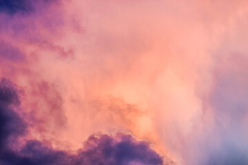 A colorful sky with clouds.A pink and purple sky with a pink cloud in the background. Phone or desktop wallpaper.