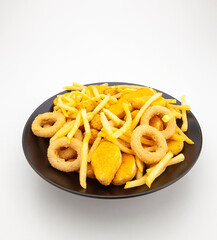 French fries, onion rings, nuggets, snacks, appetizers, hors d'oeuvre plate, black plate