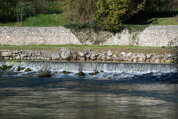 Water falls at the Livenza river resurgences in Polcenigo, Friuli. Picture taken with a telephoto...